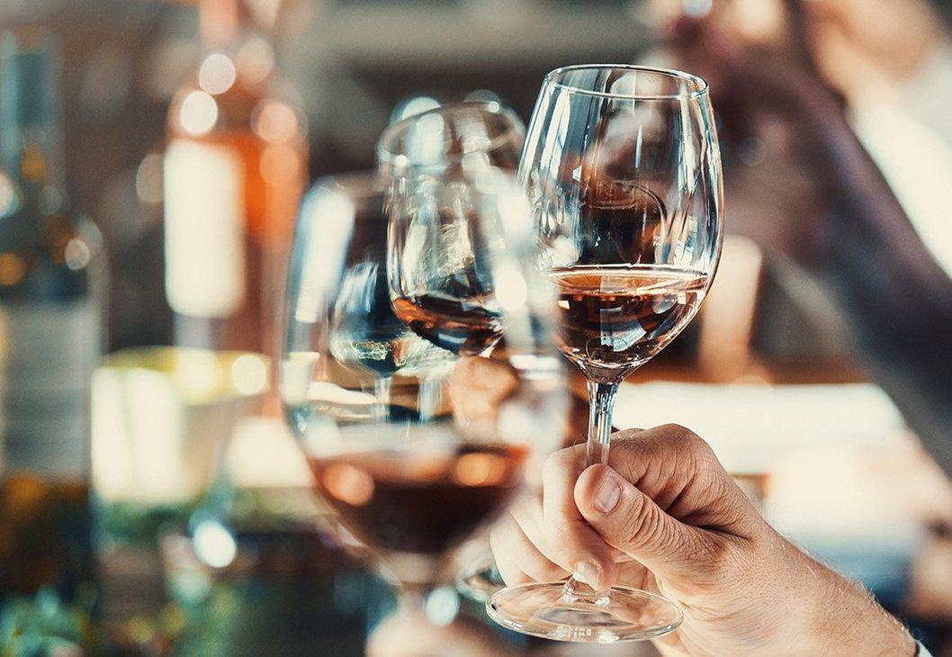 Guests raising glasses during a private wine tasting
